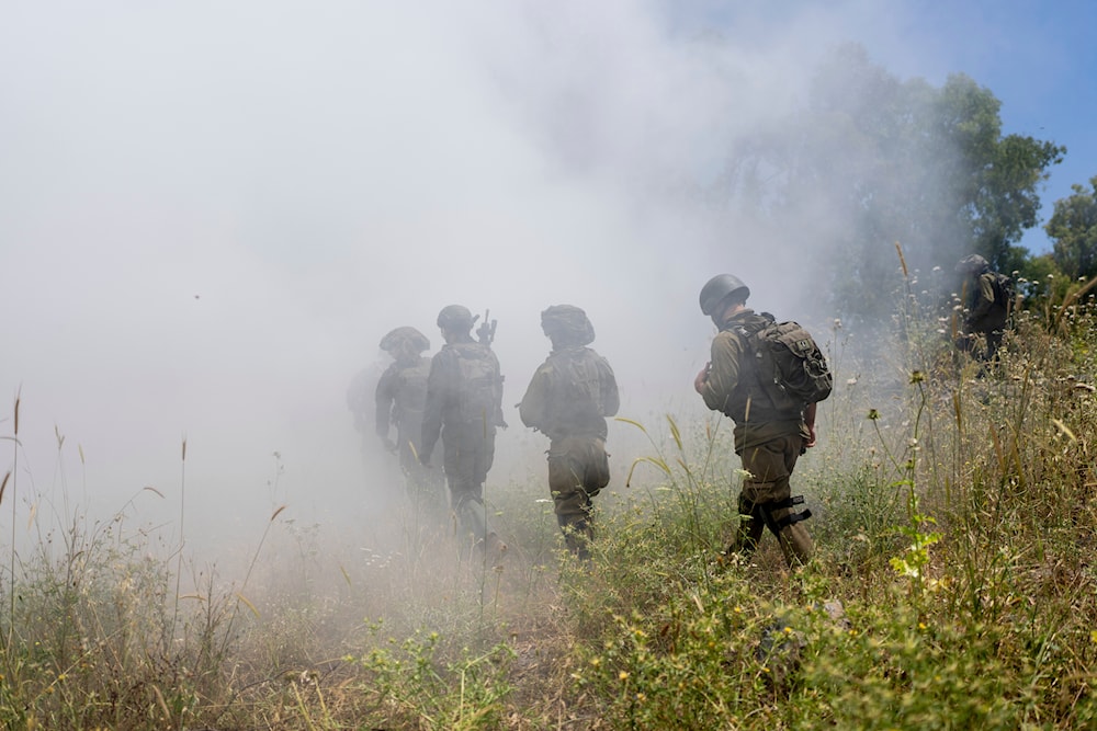 Israeli combat reservists march during training at the Israeli-controlled Golan Heights, May 8, 2024 (AP)