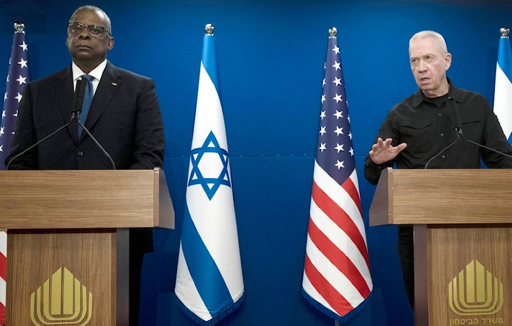 Israeli Security Minister Yoav Gallant, right, speaks during a joint statement with Secretary of Defense Lloyd Austin, in occupied Palestine, Dec. 18, 2023. (AP)