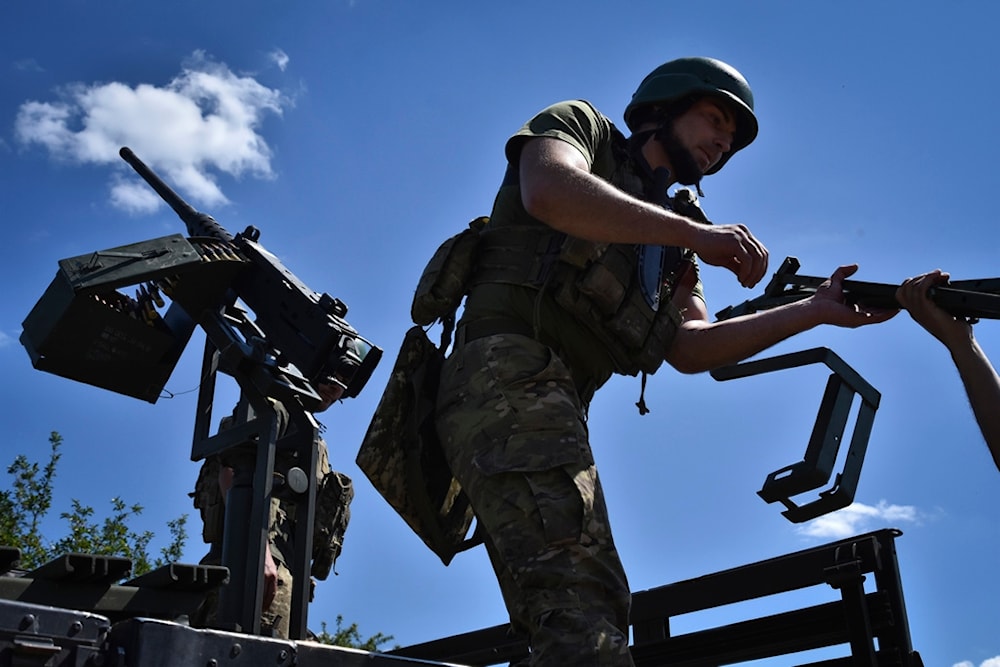Ukrainian servicemen of mobile air defence unit of Ukraine's 141st separate infantry brigade prepare their machine gun for a duty in Zaporizhzhia region, Ukraine, on Thursday, May 16, 2024. (AP)