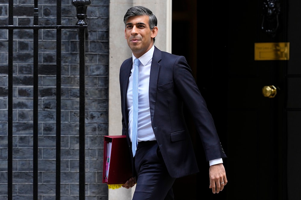 Britain's Prime Minister Rishi Sunak leaves 10 Downing Street to attend the weekly session of Prime Ministers Questions in Parliament in London on May 15, 2024. (AP)