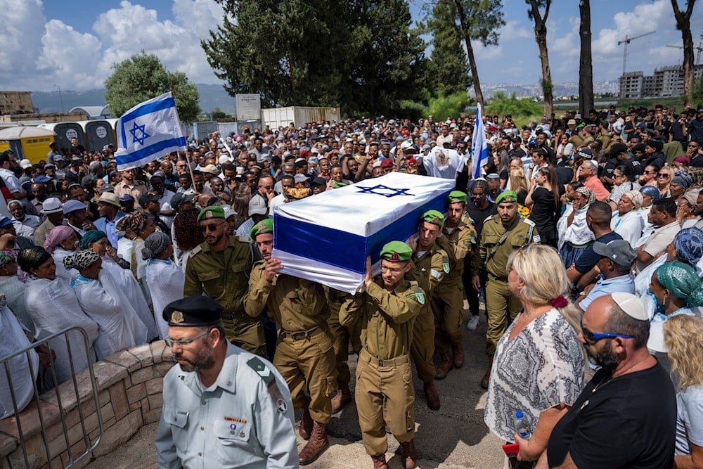 Israeli soldiers carry the casket of Sergeant Yosef Dassa during his funeral in Kiryat Ata, Israel, Sunday, May 12, 2024. (AP)