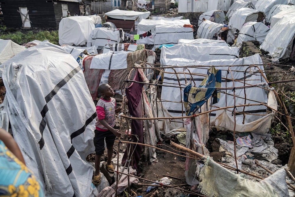 People gather at the side of an explosion in a refugee camp on the outskirts of Goma, Democratic Republic of the Congo, on May, 3, 2024. (AP)