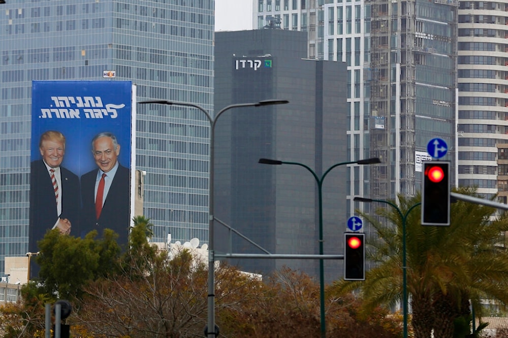 In this Wednesday, Feb. 6, 2019 photo, an election campaign billboard shows Israeli Prime Minister Benjamin Netanyahu, and US President Donald Trump in 