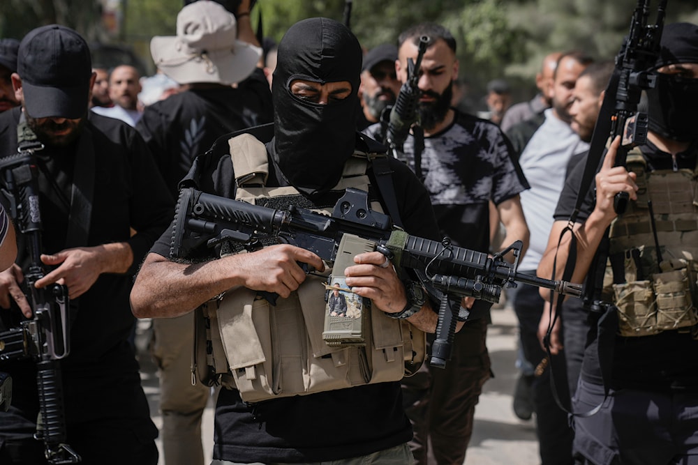 Palestinian gunmen attend the funeral of an Islamic Jihad militant group member, Islam Khamaiseh, in the West Bank Jenin refugee camp on May 18, 2024. (AP)