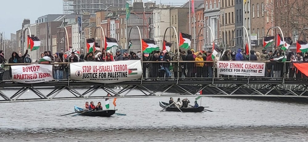 Irish people hold a New Year’s eve vigil for Palestine on the Ha’penny Bridge, Dublin, on December 31, 2023. (Social media)