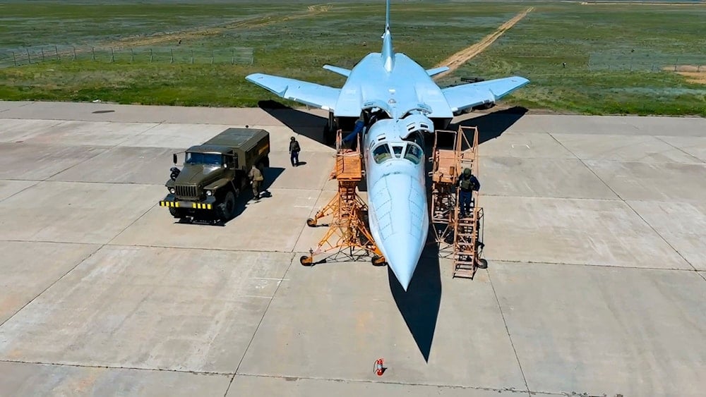 In this photo released by Russian Defense Ministry Press Service on Tuesday, May 21, 2024, Russian air force crew work to prepare a Tu-22M3 bomber for a training mission as part of drills to train the military for using tactical nuclear weapons (AP)