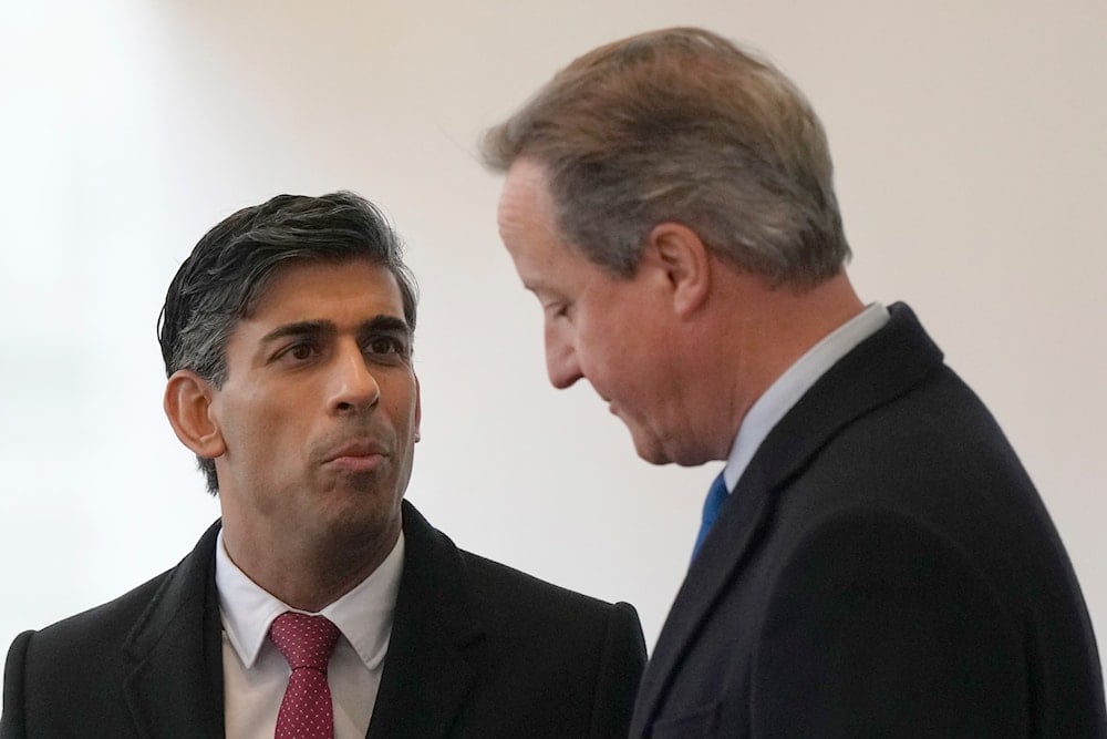 Britain's Prime Minister Rishi Sunak, left speaks with David Cameron at Horse Guards parade in London, Tuesday, Nov. 21, 2023. (AP)