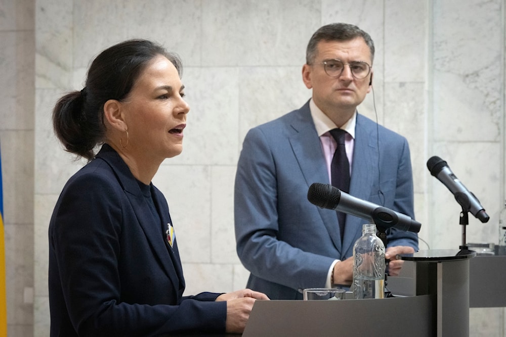 German Foreign Minister Annalena Baerbock, left, and Ukrainian Foreign Minister Dmytro Kuleba answer media questions during their press conference in Kyiv, Ukraine, Tuesday, May 21, 2024. (AP)