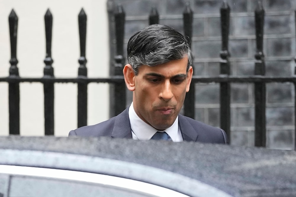 Britain's Prime Minister Rishi Sunak leaves 10 Downing Street to go to the House of Commons for his weekly Prime Minister's Questions in London, on Wednesday, May 22, 2024. (AP)