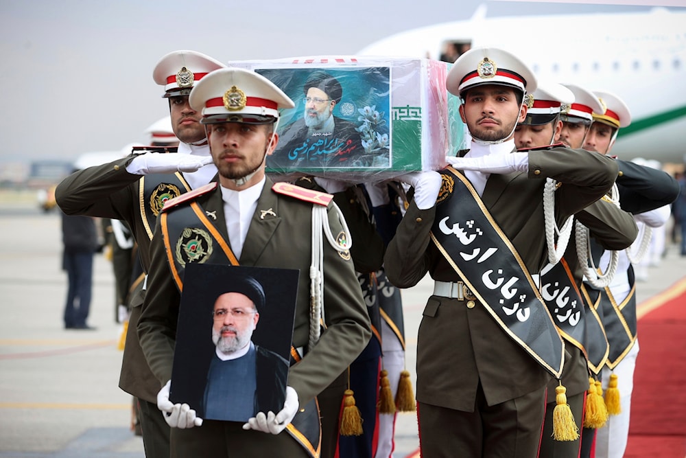 Army members carry the flag-draped coffin of President Ebrahim Raisi during a funeral ceremony at Mehrabad airport in Tehran, Iran, Tuesday, May 21, 2024. (Iranian Presidency Office/AP)