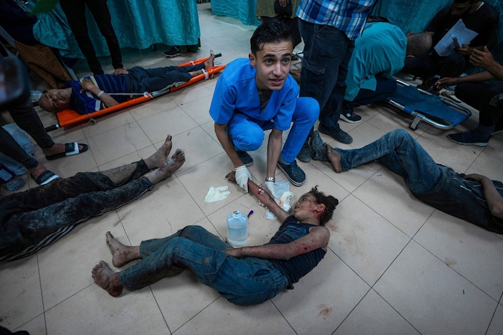 Palestinians wounded in the Israeli bombardment of the Gaza Strip are brought to Al Aqsa hospital in Deir al Balah, Gaza Strip, Tuesday, May 21, 2024. (AP)
