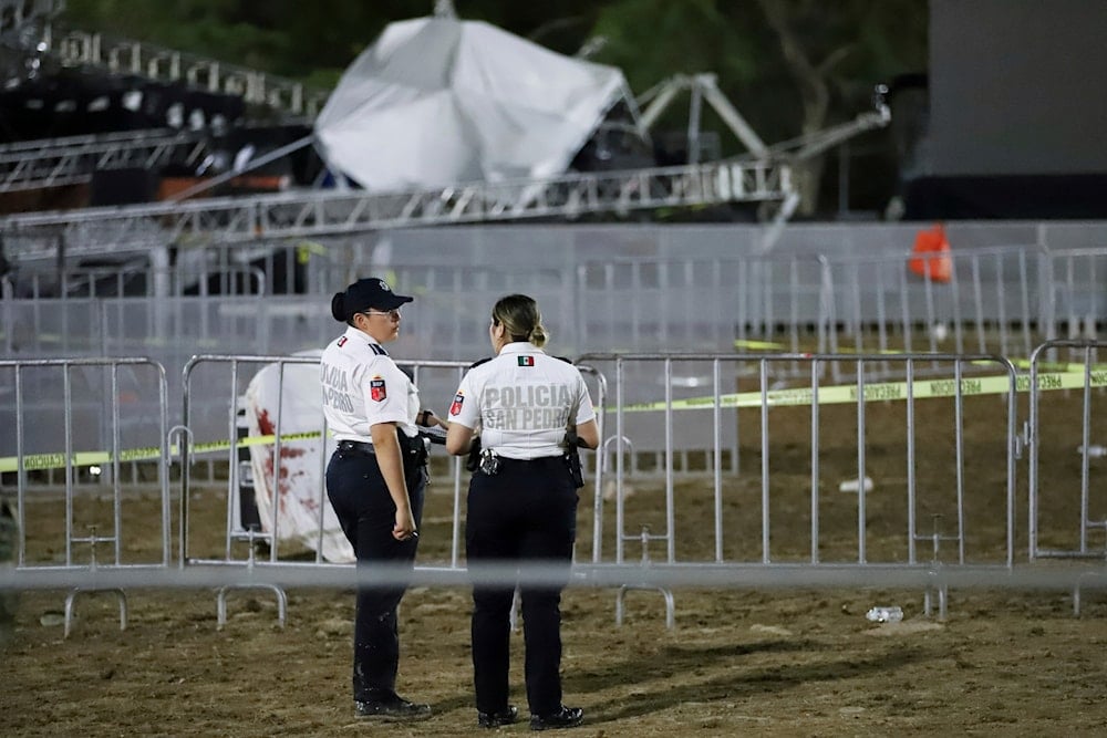 Security forces stand around a stage that collapsed during an event attended by presidential candidate Jorge Álvarez Máynez in San Pedro Garza García in Mexico, Wednesday, May 22, 2024. (AP)