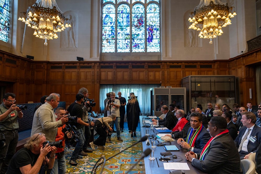 Members of the media take images of South Africa's delegation, front right, at the International Court of Justice, in The Hague, Netherlands, Thursday, May 16, 2024.(AP)