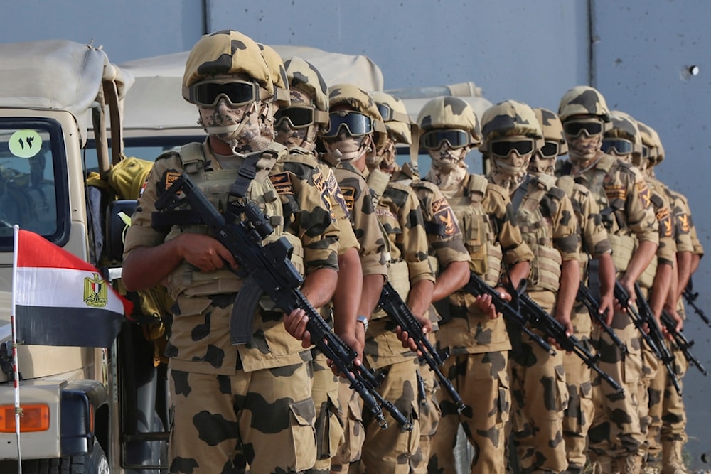 Military personnel stand alert at the Rafah border crossing between Egypt and Gaza Strip, in Rafah, Egypt, Tuesday, Oct. 31, 2023. (AP)