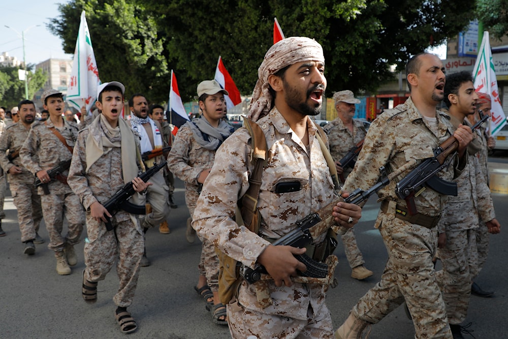 Ansar Allah supporters march marking the anniversary of Yemeni unity in Sanaa, Yemen, May 22, 2024 (AP)