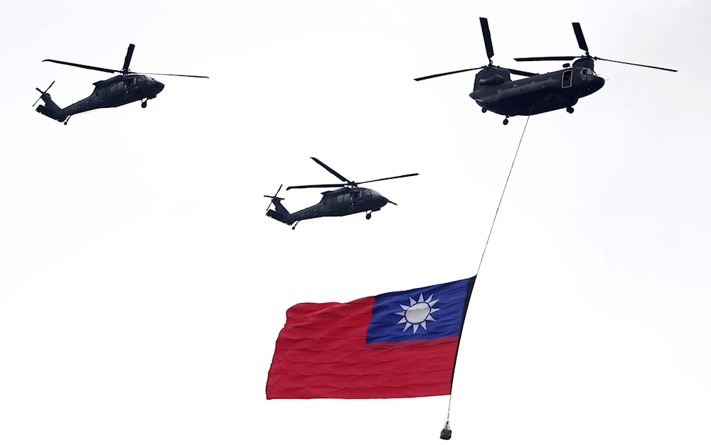 Helicopters fly over with Taiwan national flag during an inauguration celebration of Taiwan's President Lai Ching-te in Taipei, Taiwan, on May 20, 2024. (AP)