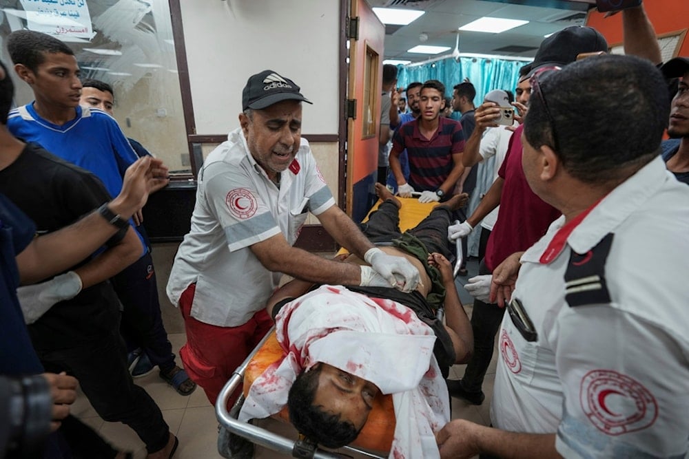 Palestinians wounded in the Israeli occupation bombardment of the Gaza Strip are brought to Al Aqsa hospital in Deir al Balah, Gaza Strip, Palestine, Thursday, May 23, 2024. (AP)