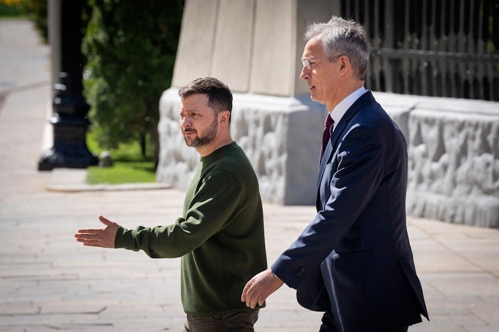 Ukrainian President Volodymyr Zelenskyy, left, welcomes NATO Secretary General Jens Stoltenberg walk before their press conference in Kiev, Ukraine, April 29, 2024 (AP)