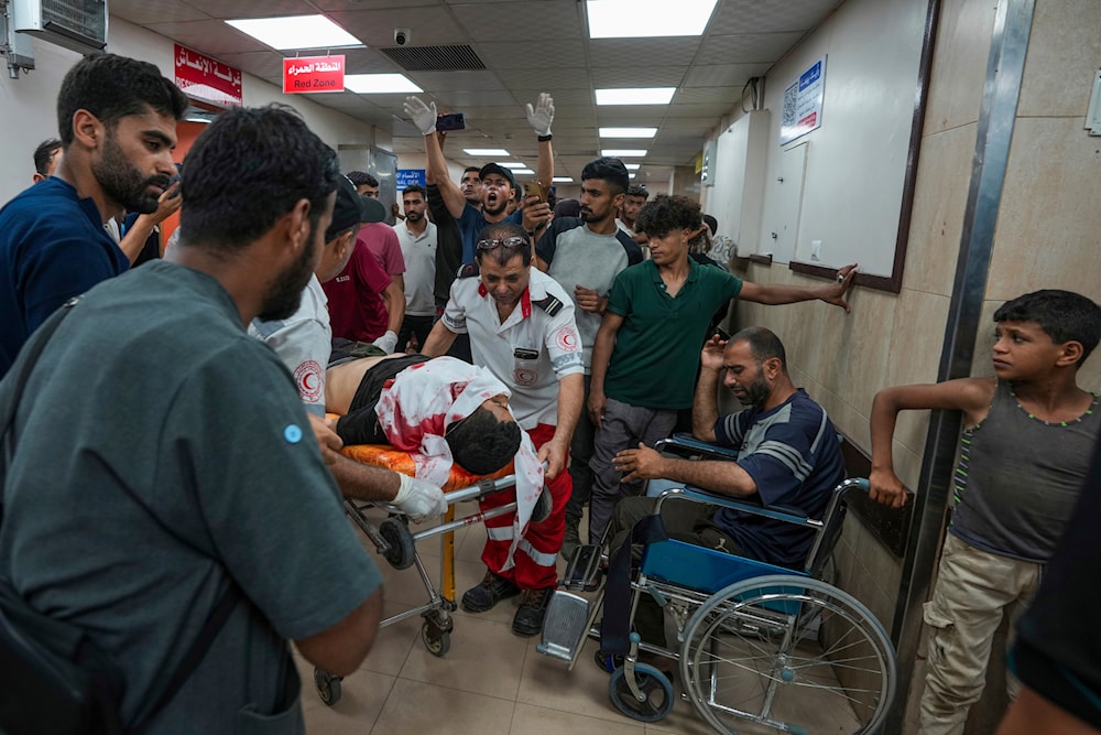 Palestinians wounded in the Israeli bombardment of the Gaza Strip are brought to Al Aqsa hospital in Deir al Balah, Gaza Strip, on May 23, 2024. 
