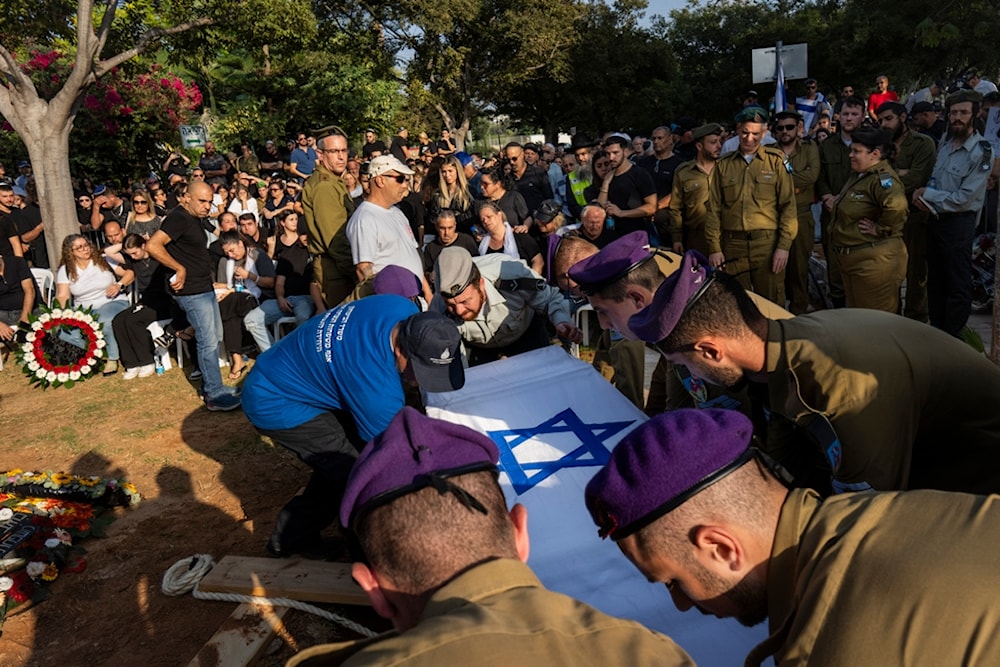Israeli soldiers lower the coffin of Sergeant killed during Gaza Strip confrontation, occupied Palestine, Nov. 2, 2023. (AP)