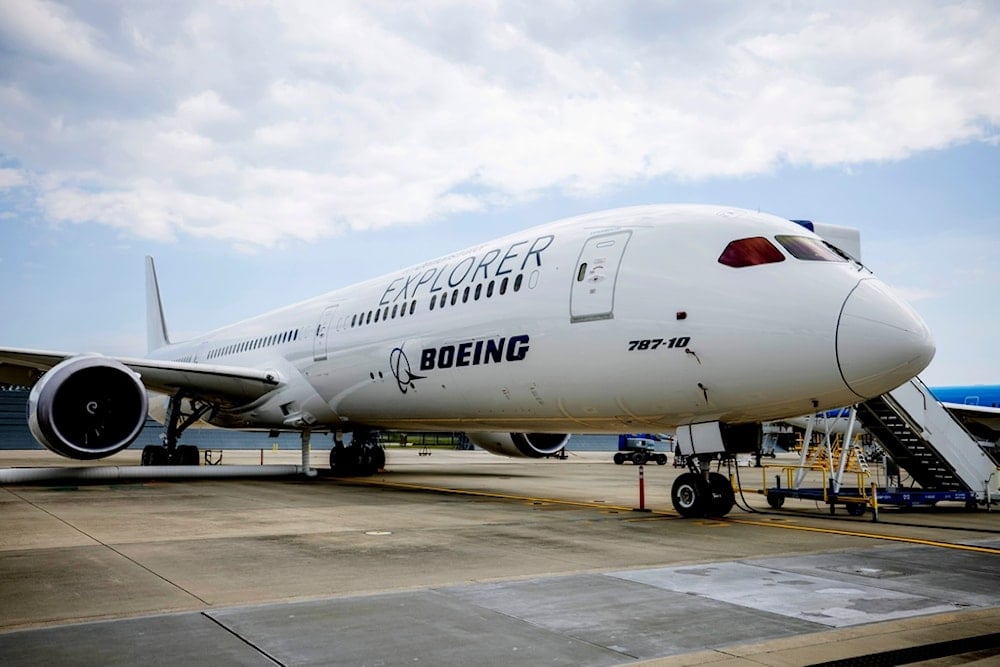 A Boeing eco-Demonstrator Explorer, a 787-10 Dreamliner, sits on the tarmac at their campus in North Charleston, S.C., May 30, 2023 (AP)