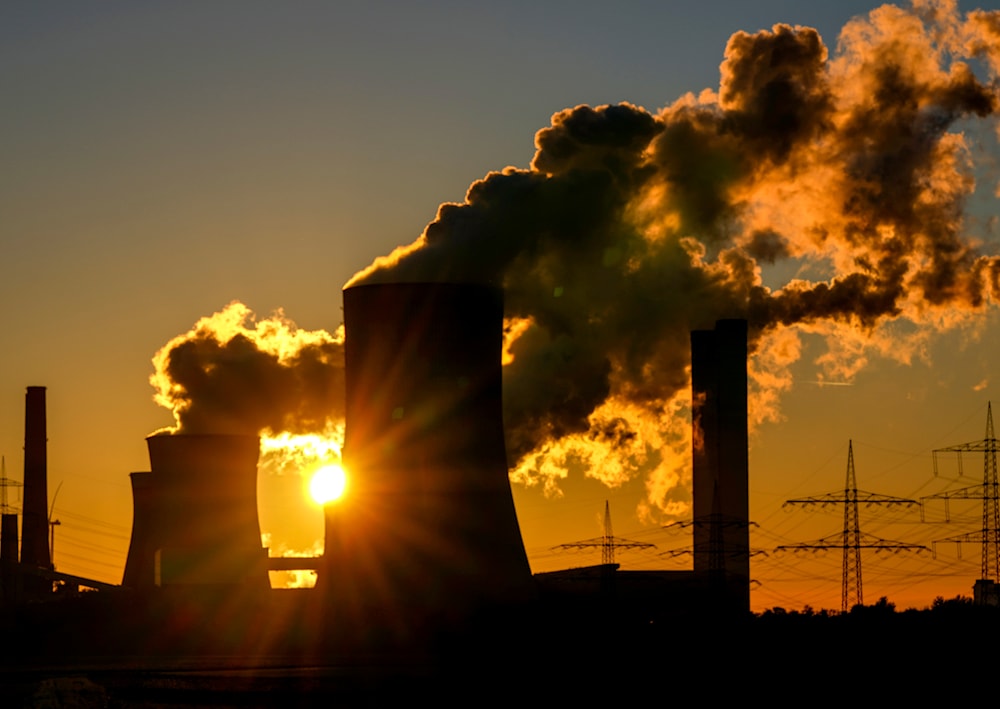 This Sunday, Oct. 24, 2021 taken photo shows chimneys of the coal-fired power station in Niederaussem, Germany. (AP)