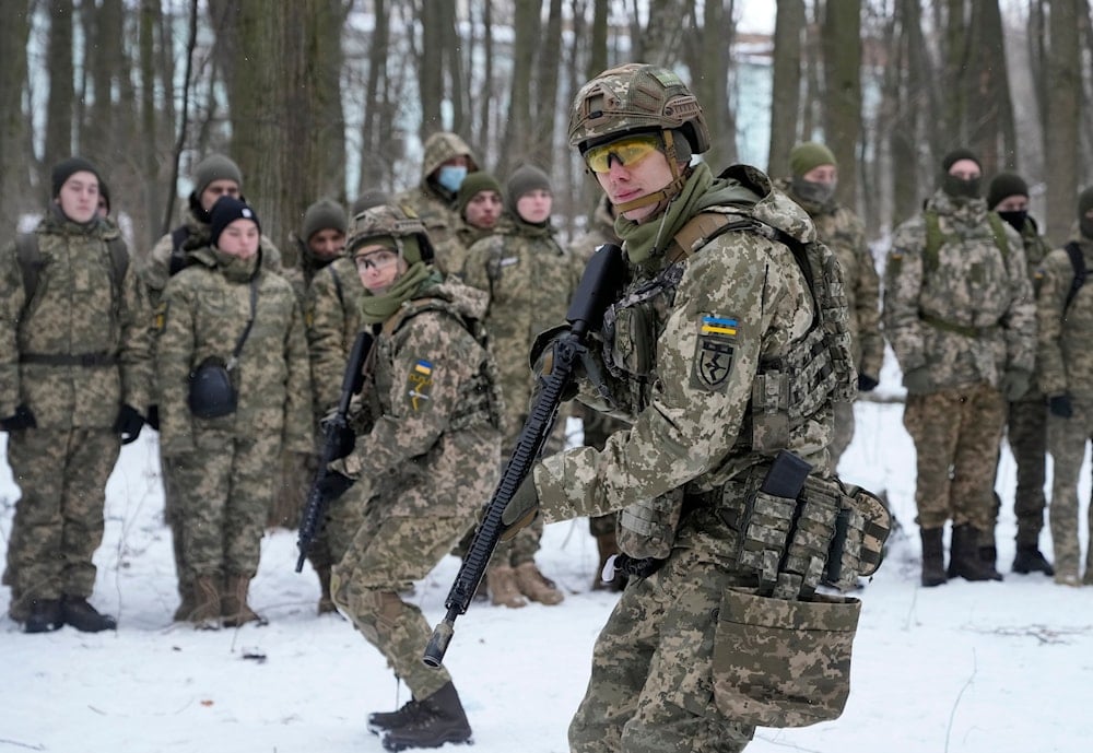 Members of Ukraine's Territorial Defense Forces, volunteer military units of the Armed Forces, train in a city park in Kiev, Ukraine, Saturday, Jan. 22, 2022. (AP)