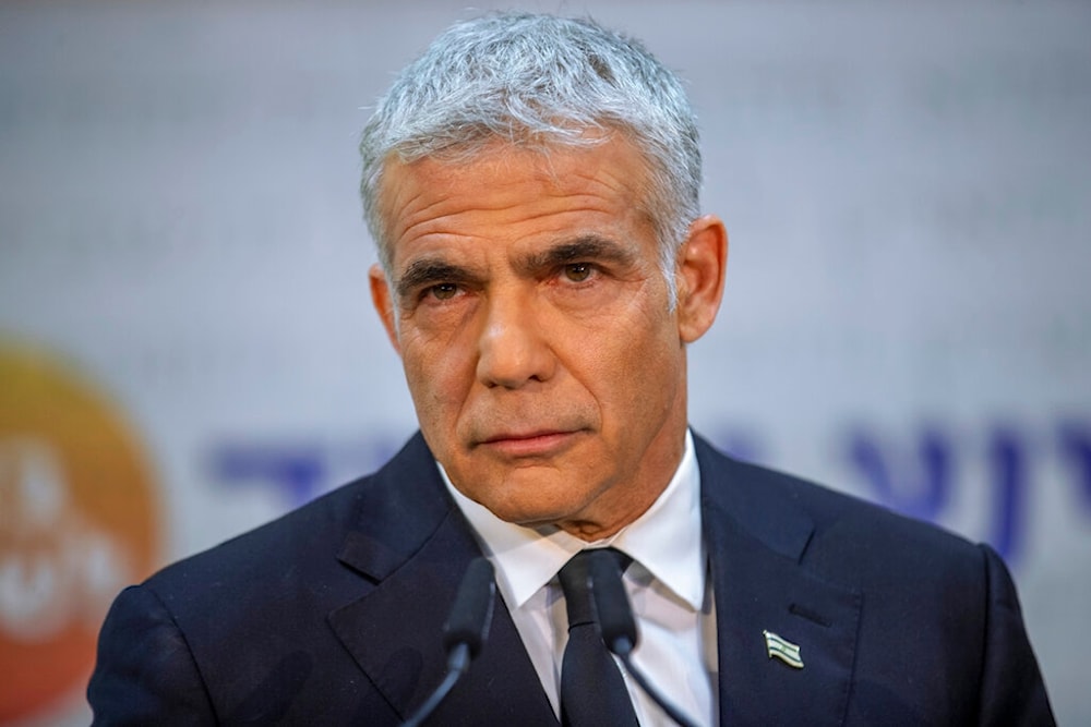 In this May 6, 2021, file photo, Israeli opposition leader Yair Lapid listens during a news conference in 