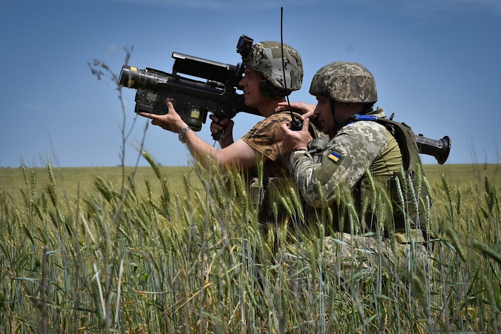 Ukrainian servicemen search a target with a US Stinger air defence missile launcher on the front line in Zaporizhzhia region, Ukraine, Tuesday, May 28, 2024. (AP)