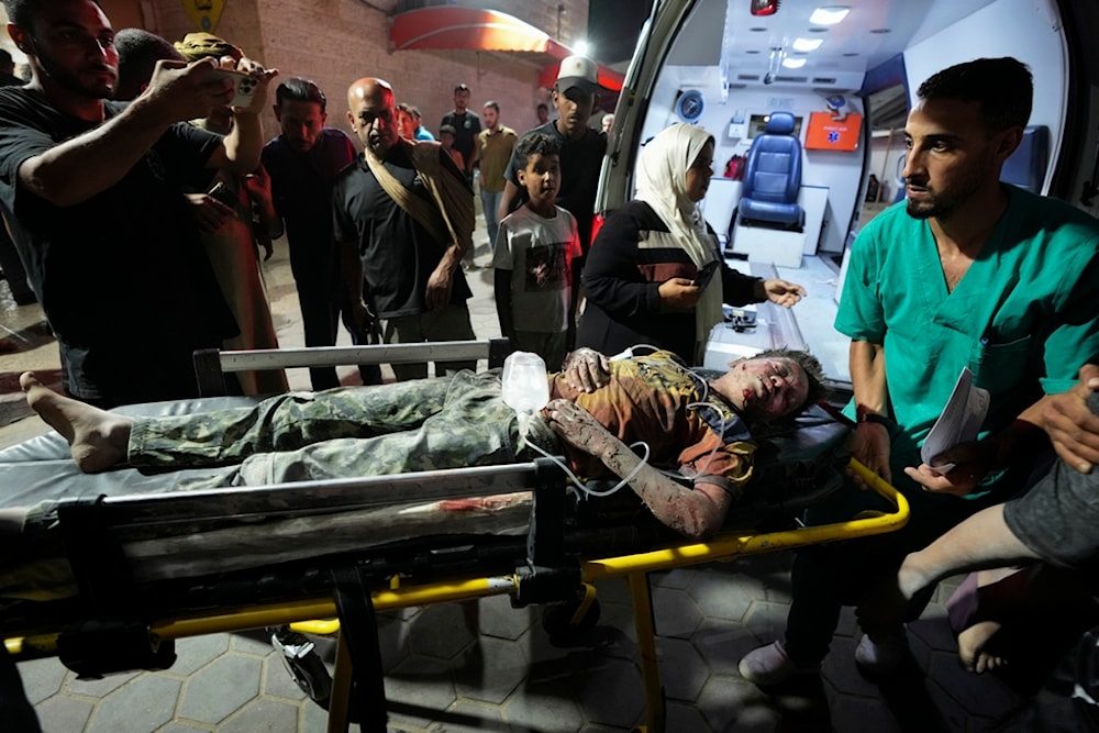 A Palestinian wounded in an Israeli bombardment on the Gaza Strip is brought to Al Aqsa hospital in Deir al Balah, central Gaza Strip, on Sunday, May 26, 2024. (AP)