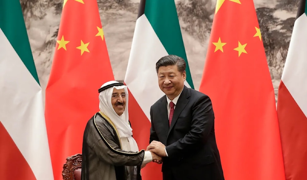 Kuwait's Emir Sabah al-Ahmed al-Sabah, left, shakes hands with Chinese President Xi Jinping after a signing ceremony in Beijing, China, July 9. (AP/Pool)