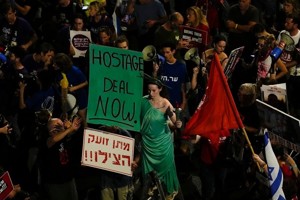 People protest against Israeli Prime Minister Benjamin Netanyahu's government and call for the release of captives held in the Gaza Strip in Tel Aviv, Saturday, June 1, 2024. (AP)