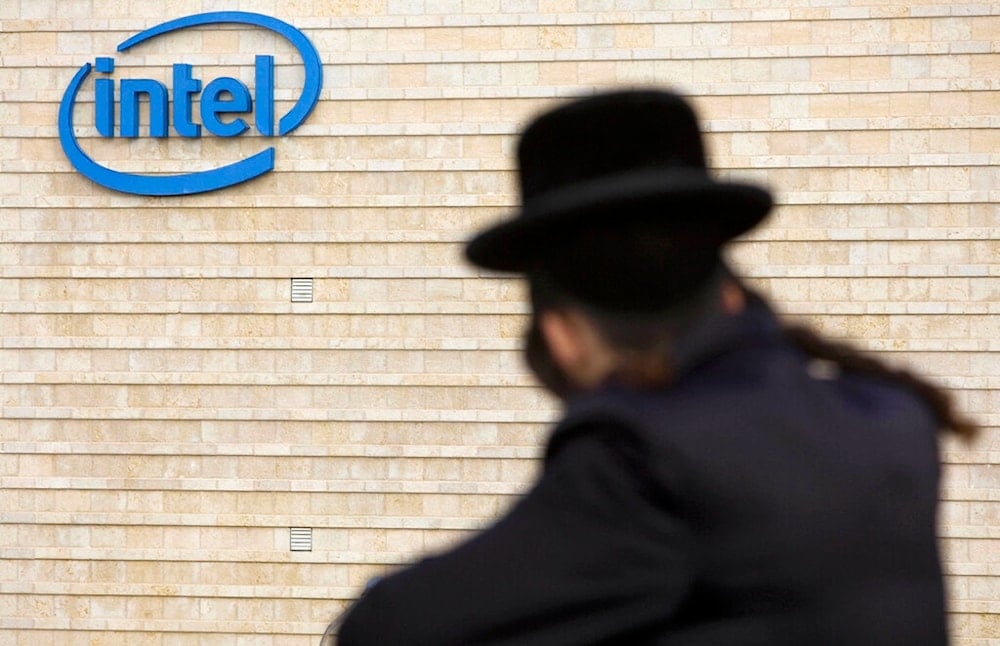 In this file photo taken on Saturday, Nov. 14, 2009, an ultra-orthodox Jewish man is seen next to Intel's al-Quds office building (AP Photo)