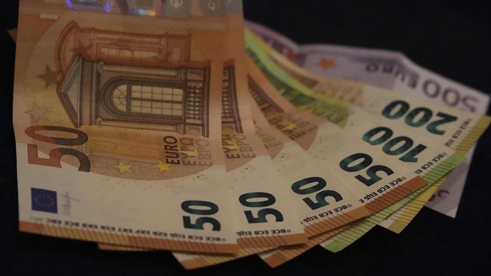 Euro banknotes are displayed on a table in Munich, Germany on March 30, 2022. (AP)