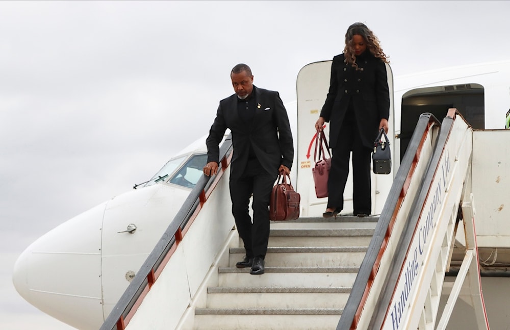 Malawi Vice President Saulos Chilima,left, and his wife Mary disembark from a plane upon his return from South Korea in Lillongwe, Sunday, June 9, 2024. (AP)