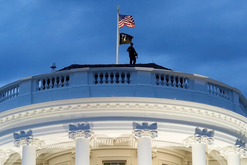 A member of the U.S. Secret Service stands on the roof of the White House during a Juneteenth concert on the South Lawn of the White House in Washington, on June 10, 2024. (AP)