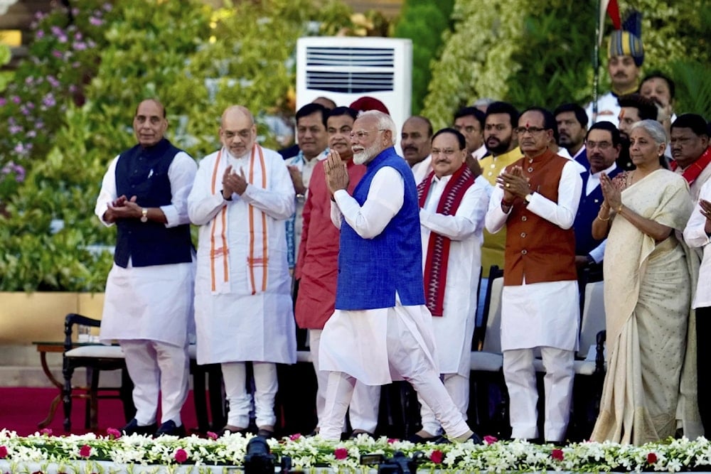 Narendra Modi greets the gathering as he arrives to take oath as the Prime Minister of India at the Rashtrapati Bhawan, in New Delhi, India, on June 9, 2024. (AP)