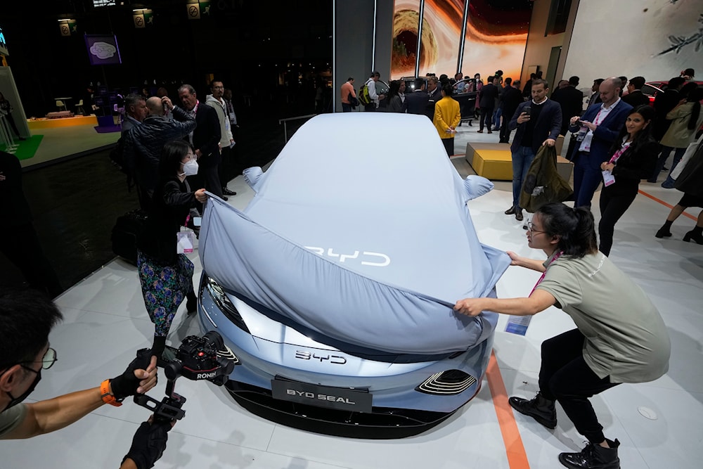 Chinese EV manufacturer BYD unveils its electric car Seal at the Paris Car Show on Oct. 17, 2022, in Paris. (AP)