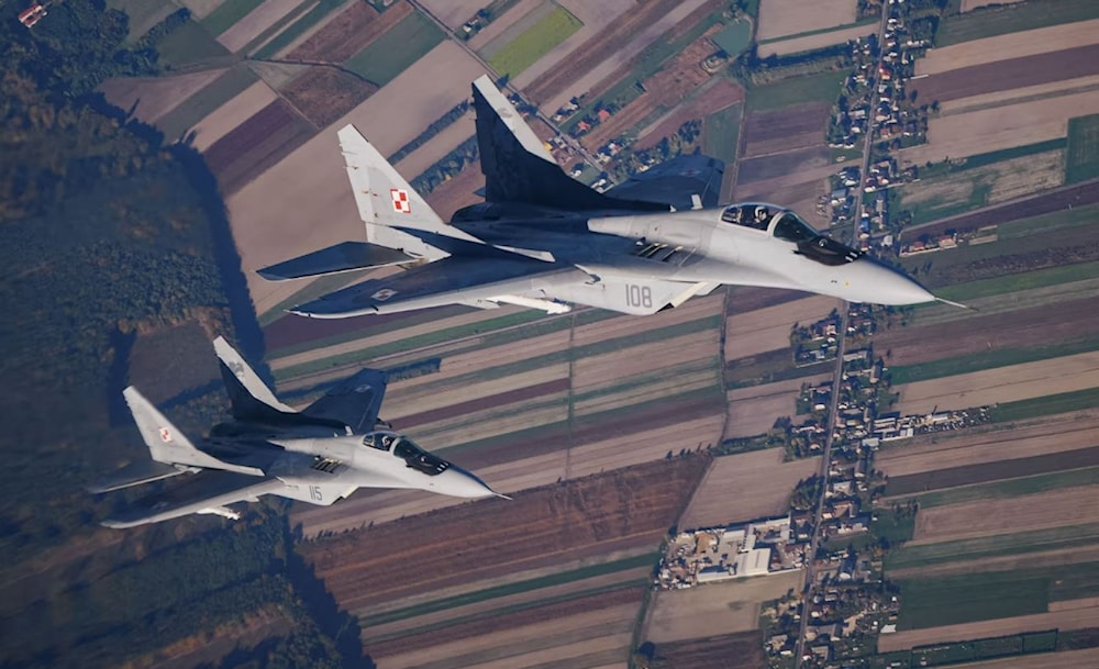 Two Polish MiG-29 fighter jets taking part in a Nato exercise near the air base in Lask, central Poland, in 2022. (AFP / Getty Images)