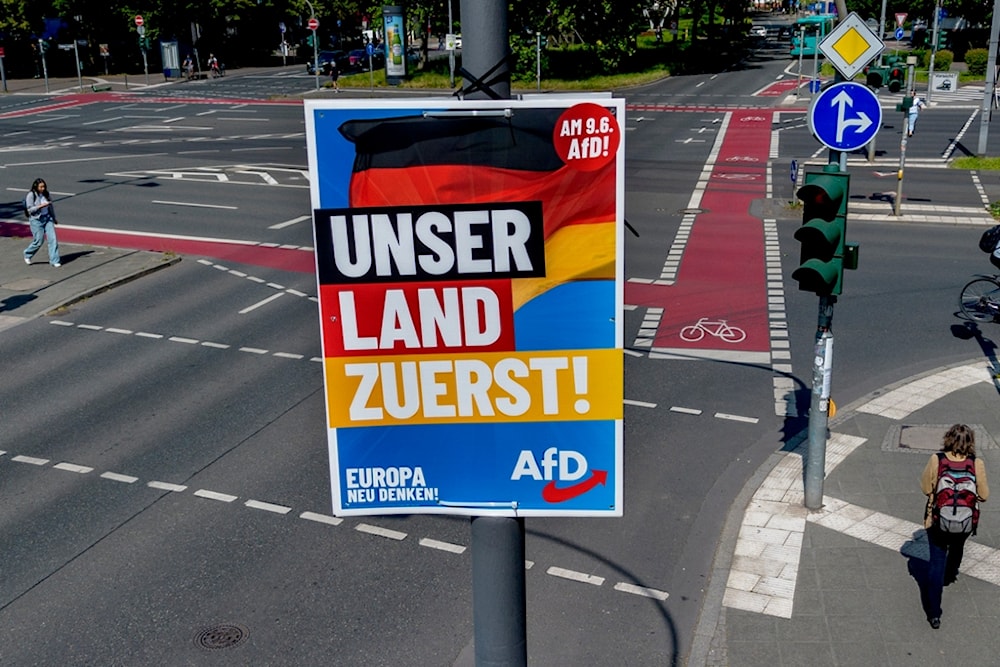 An election poster of German far right AfD party is fixed on a lamp pole in Frankfurt, Germany, Monday, June 10, 2024. (AP Photo/Michael Probst)