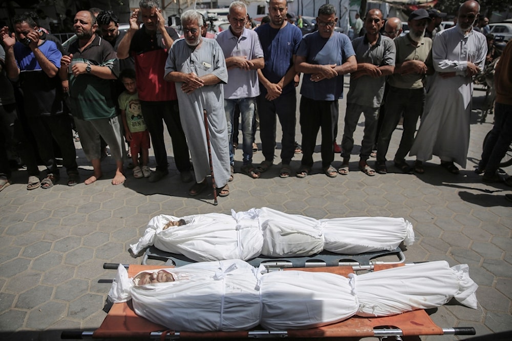 Mourners pray at the funeral for Palestinian youth killed along with his uncle, after Israeli occupation gunboats opened fire on them while fishing in Deir al Balah, Gaza Strip, , June 14, 2024. (AP)