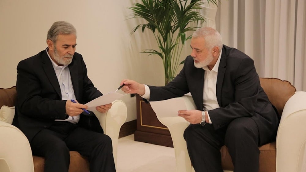 Hamas leader, Ismail Haniyah (right) and Islamic Jihad leader, Ziad al-Nakhalah (left) discuss a ceasfire deal in dohar, Qatar on June 12, 2024. (Palestinian Media)