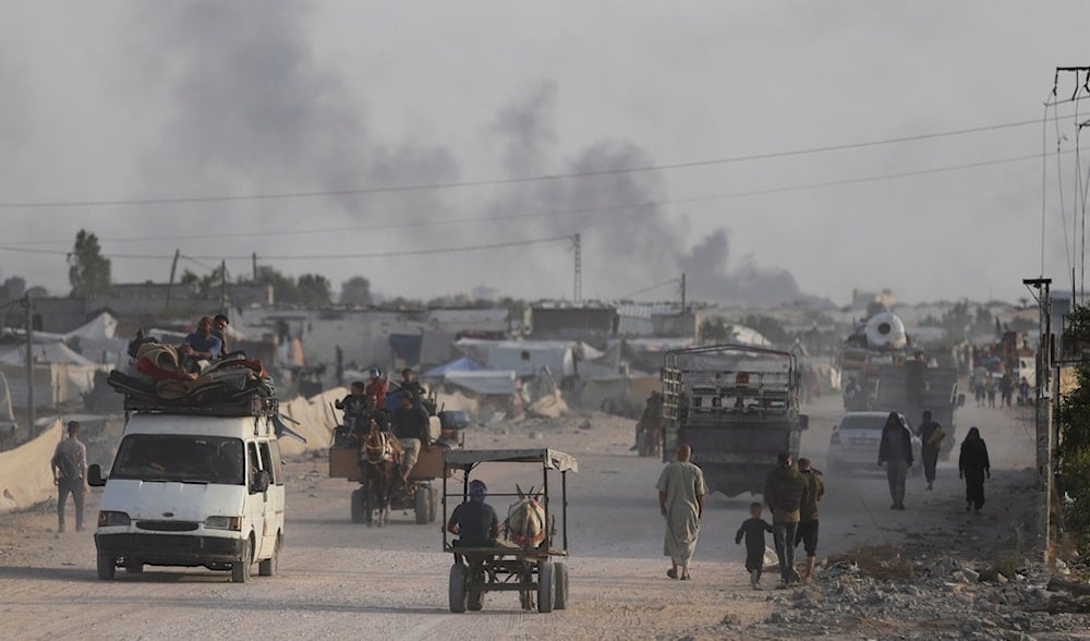 Palestinians fleeing from the southern Gaza city of Rafah during an Israeli ground and air offensive in the city, May 28, 2024. (AP)