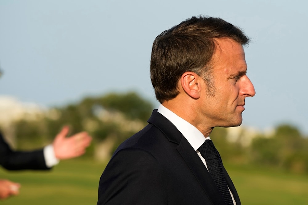 French President Emmanuel Macron arrives to talk to journalists after watching a skydiving demo during the G7 world leaders summit at Borgo Egnazia, Italy, Thursday, June 13, 2024. (AP)