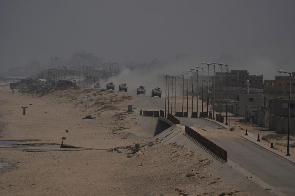 Israeli armored vehicles drive through Deir al-Balah, Gaza Strip, on June 8, 2024. (AP)