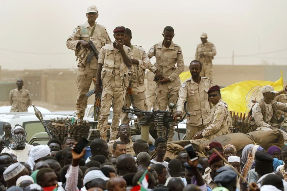 Sudanese soldiers from the Rapid Support Forces unit stand on their vehicle during a military-backed rally, in Mayo district, south of Khartoum, Sudan, Saturday, June 29, 2019. (AP)