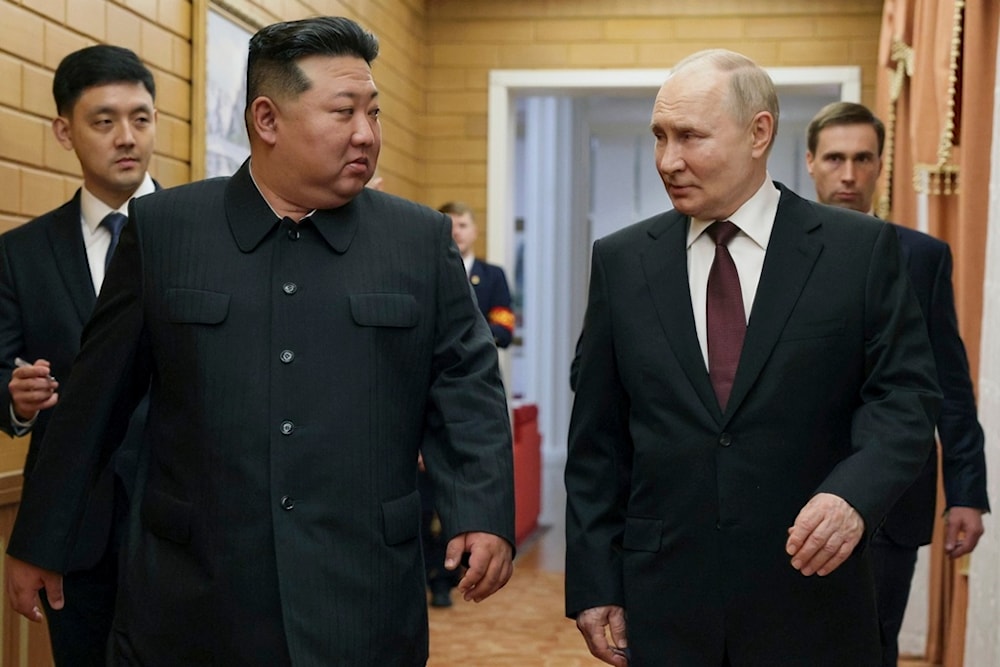 Russian President Vladimir Putin, right, and North Korea's leader Kim Jong Un talk to each other during their meeting in Pyongyang, North Korea, early Wednesday, June 19, 2024. (AP)