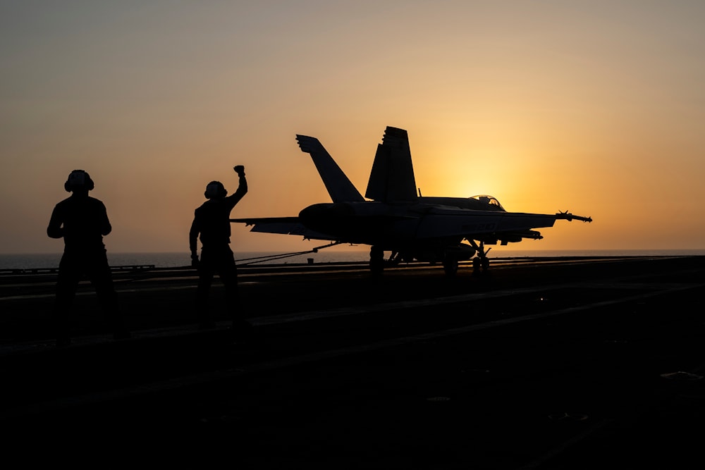 A fighter jet lands on the USS Dwight D. Eisenhower, also known as 