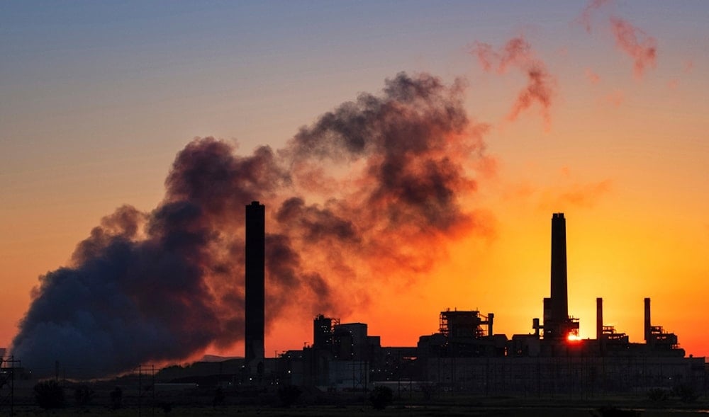 A coal-fired power plant is silhouetted against the morning sun on July 27, 2018, in Glenrock, Wyo. (AP)