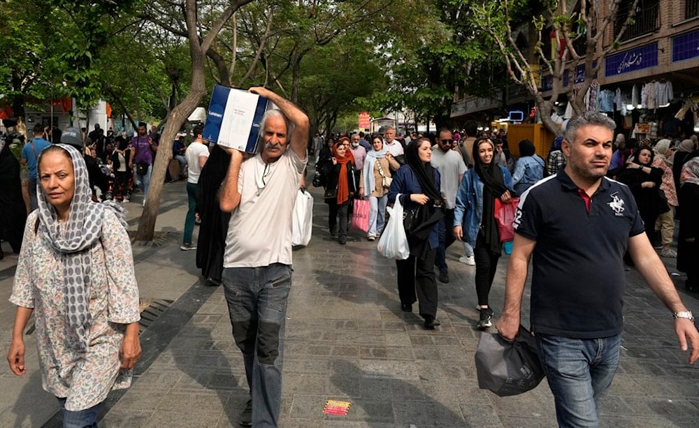 Illustrative image of people shopping at the old main bazaar in Tehran, Iran, Tuesday, April 16, 2024 (AP Photo/Vahid Salemi)